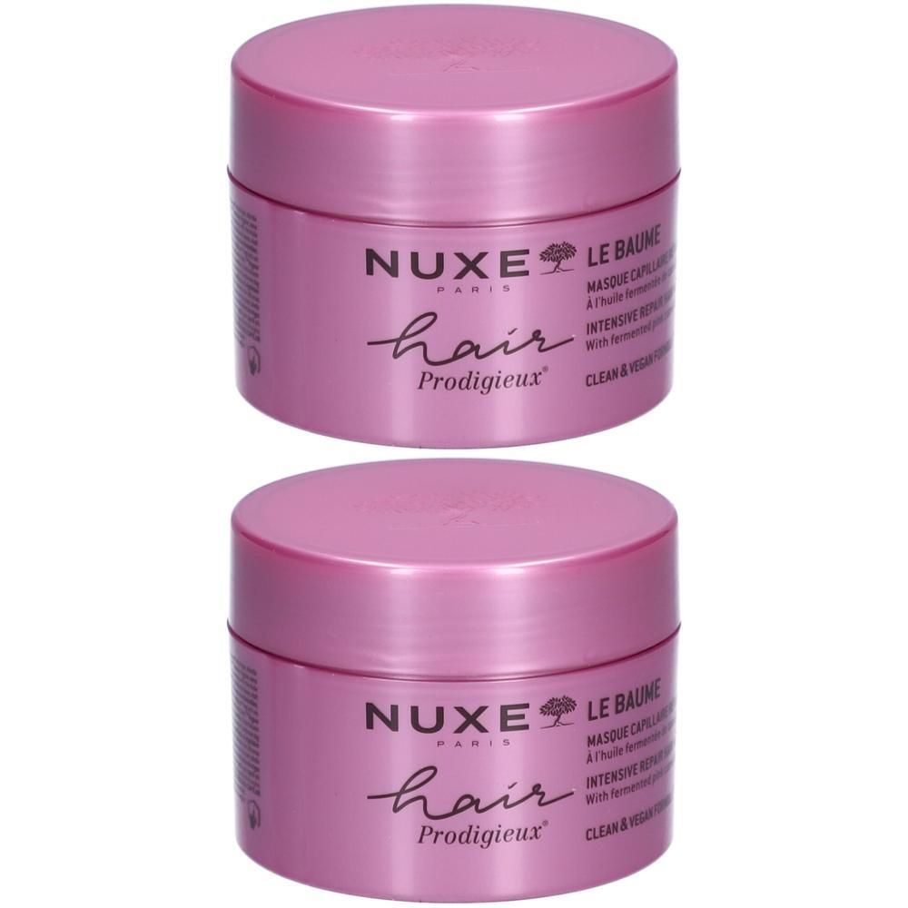 Deux pots roses. Inscription: Nuxe Hair Prodigieux, Le Baume, Masque capillaire réparation intense. Vegan.