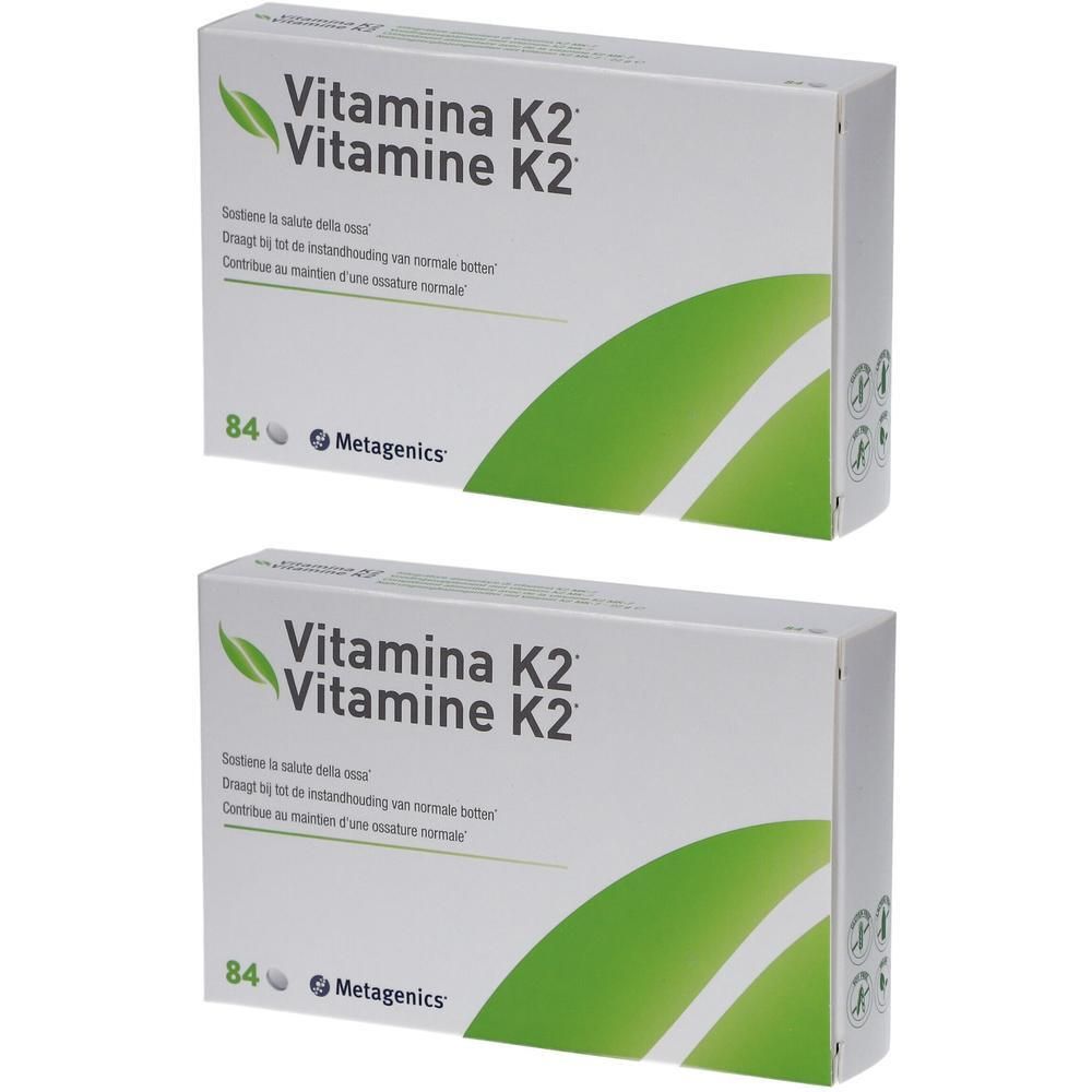 Deux boîtes de Metagenics Vitamine K2. Emballage blanc avec accents verts et informations produit.