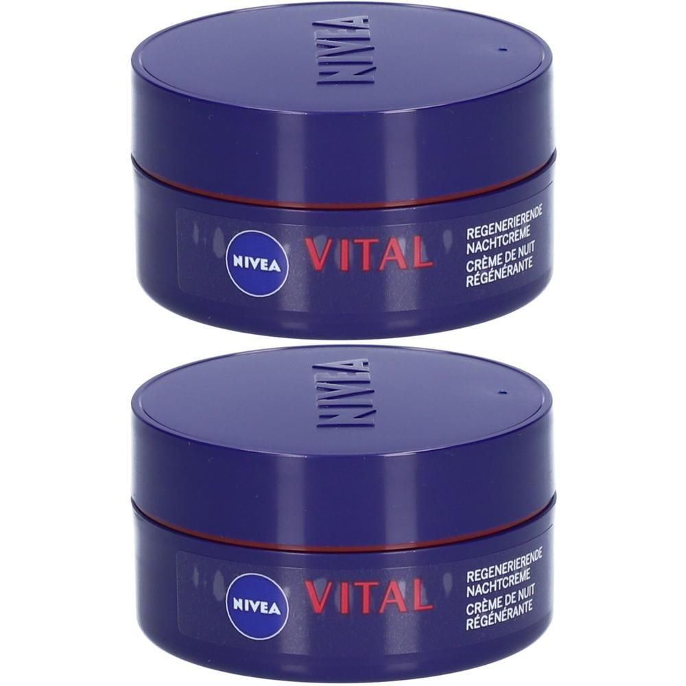 Deux pots bleus de crème de nuit Nivea Vital. Inscription rouge Vital, texte en allemand et français.