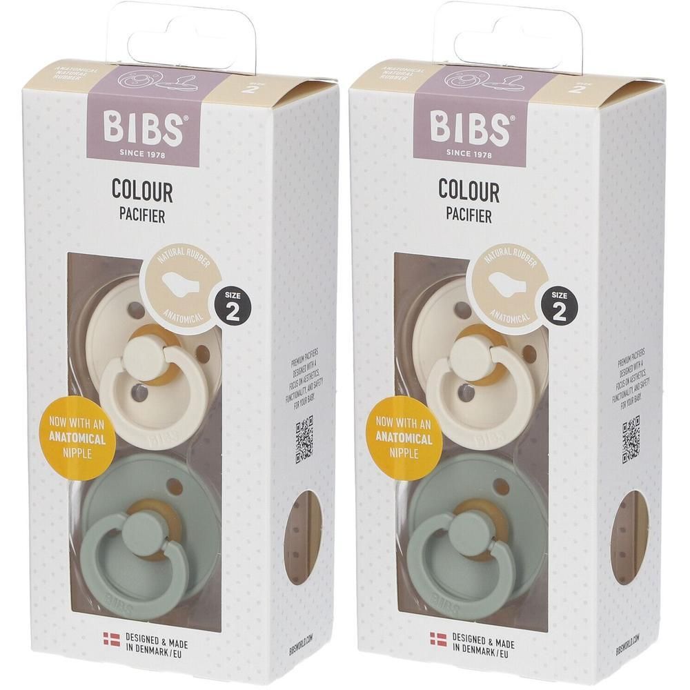 Deux boîtes de sucettes BIBS. Chaque boîte contient deux sucettes crème et vertes. Visible : marque, taille 2.