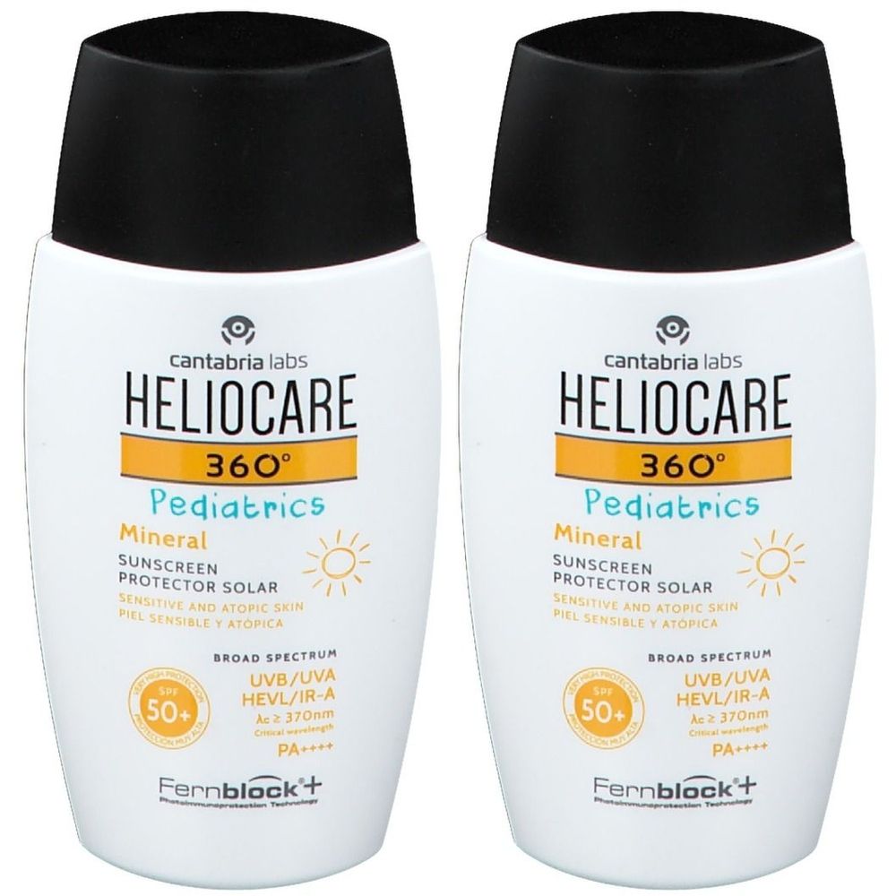 Deux flacons blancs avec bouchon noir. Inscription: Heliocare 360° Pediatrics Mineral SPF50+. Crème solaire pour enfants.