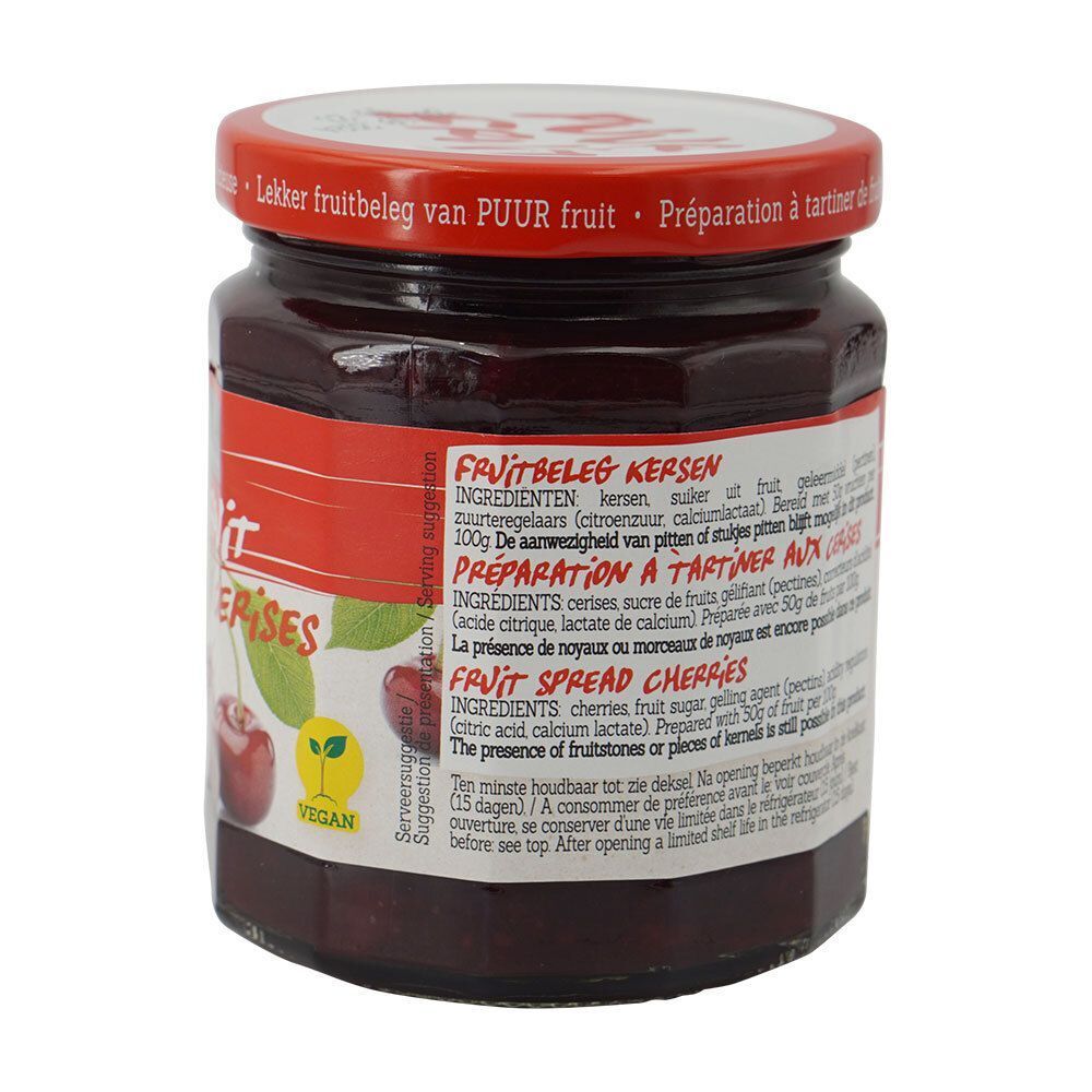 Dos d'un pot de confiture Damhert Puur Fruit aux cerises. Liste des ingrédients. Couvercle rouge. Logo végétalien.