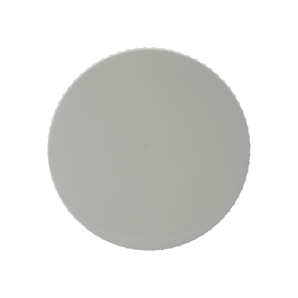 Vue de dessus d'un pot blanc avec couvercle cannelé.