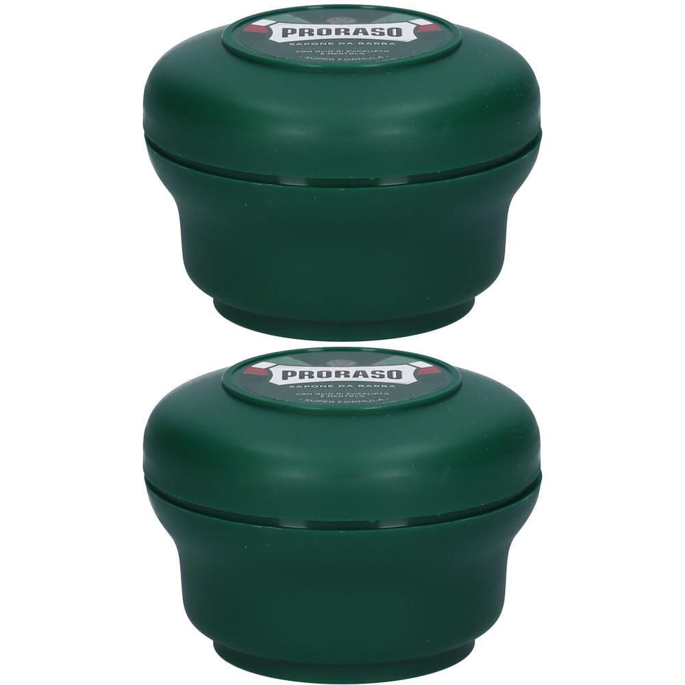 Deux pots de savon à raser verts avec couvercles. "Proraso" est visible.
