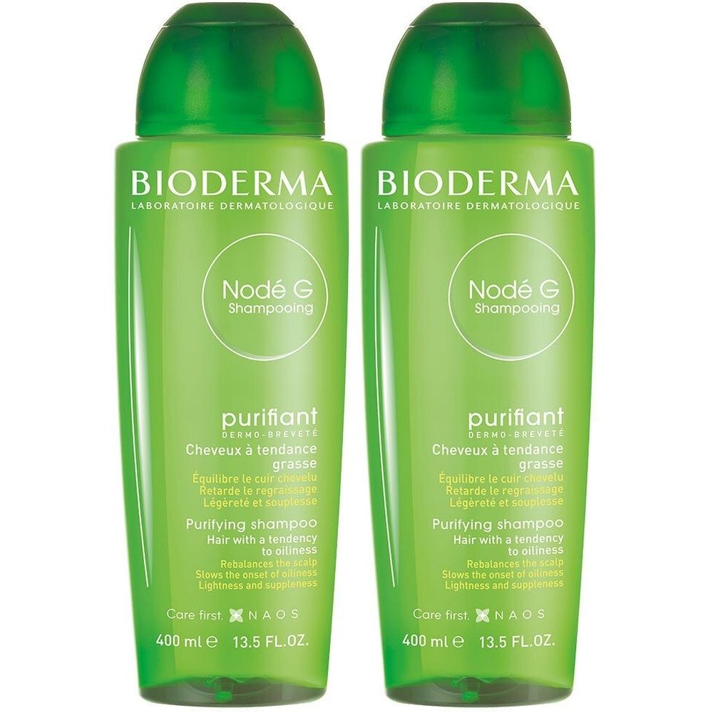 Deux flacons verts de shampooing Bioderma Nodé G. Inscription : purifiant, pour cheveux gras. 400 ml.