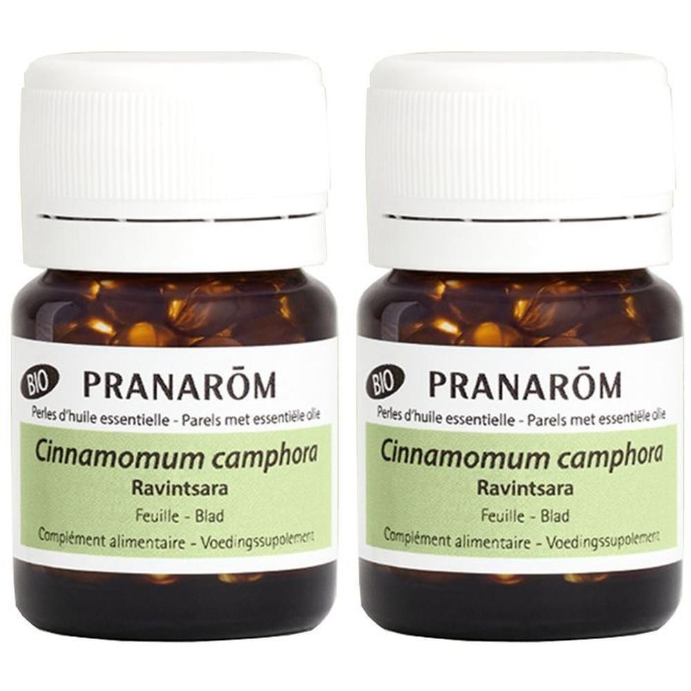 Deux flacons avec bouchons blancs. Étiquettes "PRANAROM", "Cinnamomum camphora Ravintsara". Certification BIO.