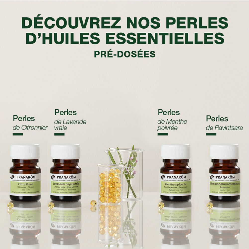 Plusieurs flacons avec bouchons blancs. Texte: "PRANAROM". Perles de Lavande, Menthe poivrée, Ravintsara.
