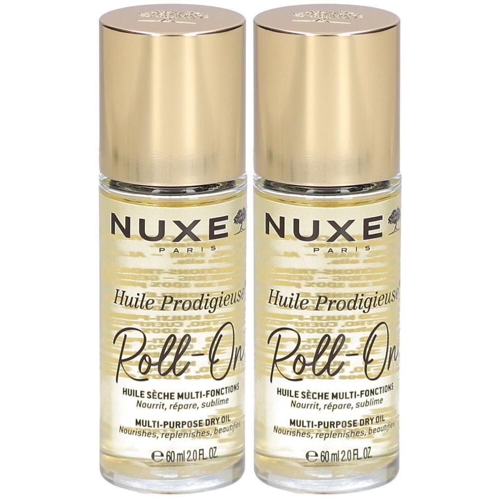 Deux flacons Nuxe Huile Prodigieuse Roll-On. Bouchons dorés, flacons transparents avec liquide jaune. Texte: Nuxe, Huile Prodigieuse.