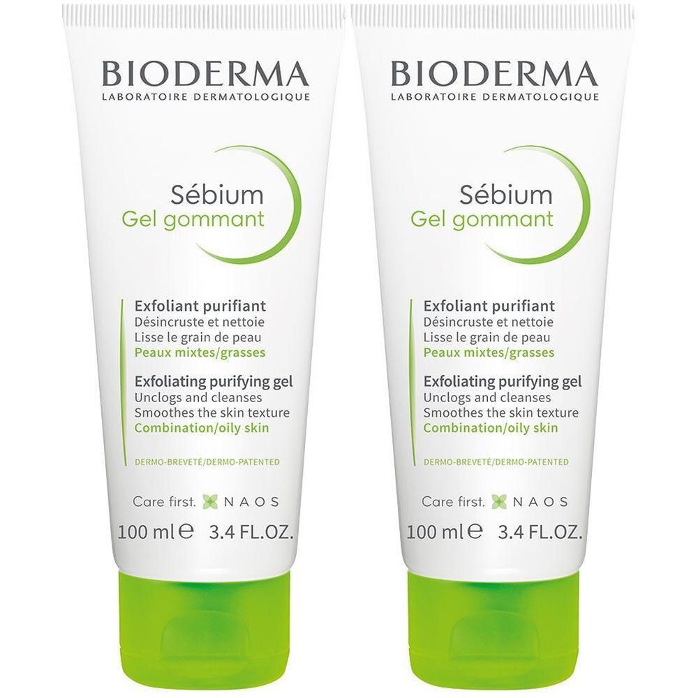Deux tubes de Bioderma Sébium Gel gommant. Tubes blancs avec texte et bouchon verts. Nom du produit et marque visibles.