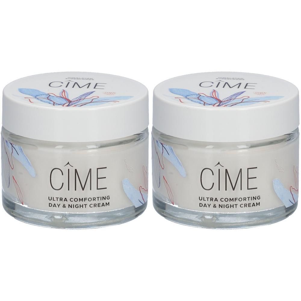 Deux pots de crème avec couvercles blancs. Inscription: Cîme, Ultra Comforting Day & Night Cream. Récipients en verre, motifs floraux.