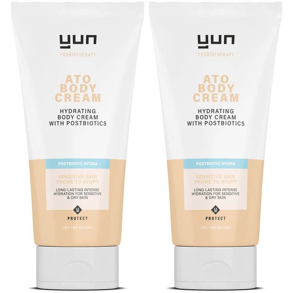 Deux tubes de crème. Inscription : ATO BODY CREAM, hydratant avec postbiotiques. Pour peaux sensibles à tendance atopique.