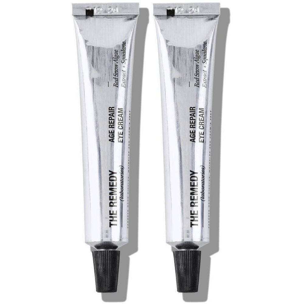 Deux tubes argentés de crème pour les yeux. Inscription : AGE REPAIR EYE CREAM, THE REMEDY (laboratories).