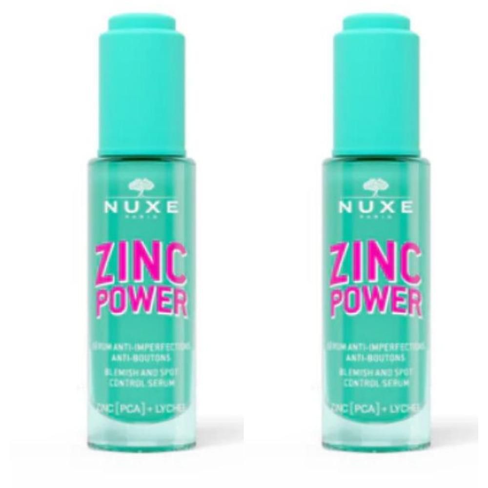 Deux flacons de sérum Nuxe Zinc Power. Flacons turquoise avec bouchons turquoise. Inscription rose ZINC POWER.