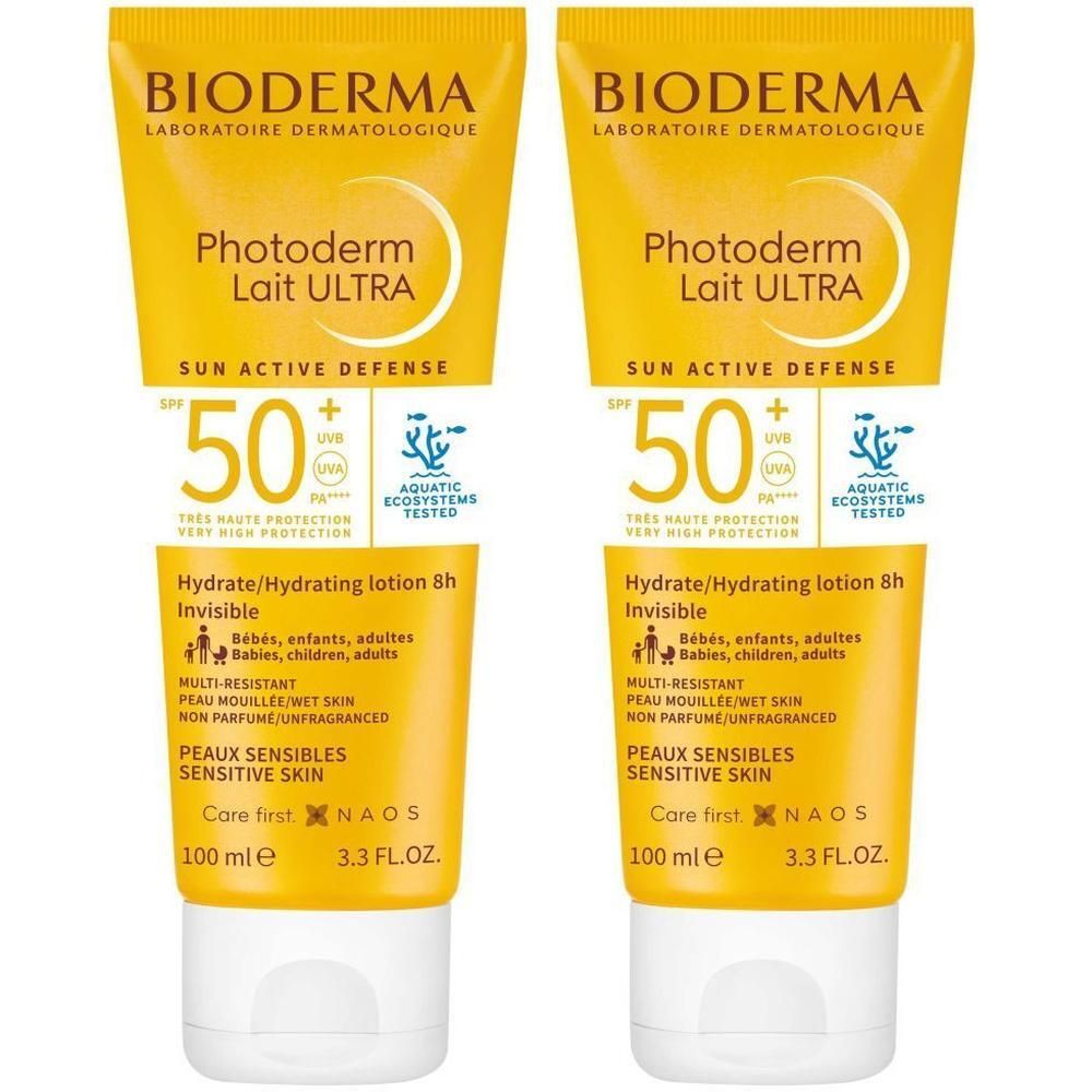 Deux tubes de crème solaire. Emballage jaune avec bouchon blanc. Inscription: BIODERMA Photoderm Lait Ultra SPF50+.