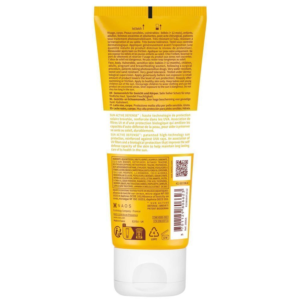 Dos d'un tube de crème solaire. Fond jaune avec texte. Contient des informations sur les ingrédients et l'utilisation.