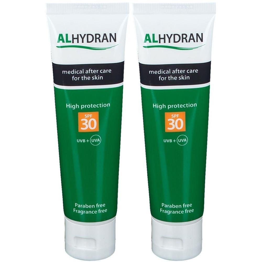 Deux tubes de crème solaire ALHYDRAN SPF 30. Emballage vert et blanc. Protection élevée. Sans parabène.