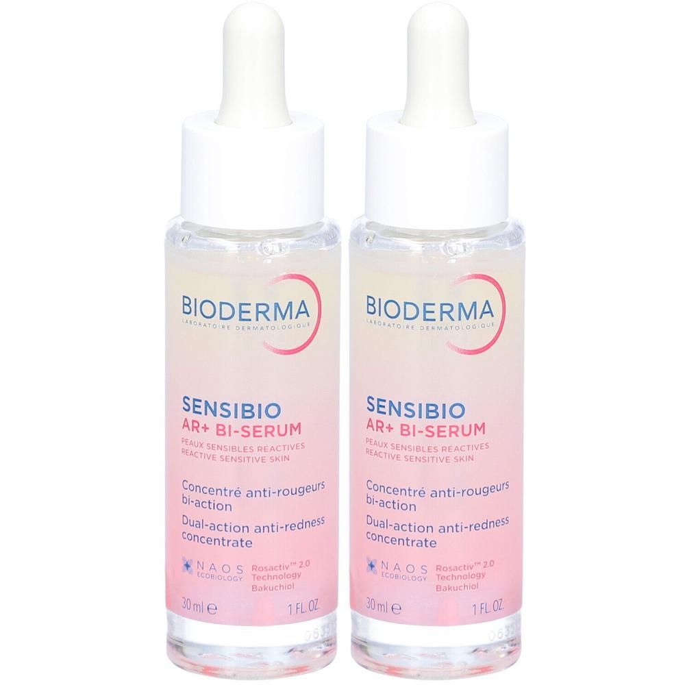 Deux flacons de Bioderma Sensibio AR+ Bi-Sérum. Étiquette rose, bouchon blanc avec pipette. Texte: Sensibio AR+ Bi-Sérum, 30ml, 1 FL.OZ.