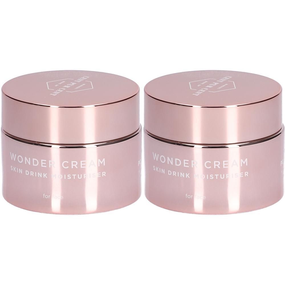 Deux pots roses avec couvercles. Inscription : Wonder Cream Skin Drink Moisturizer.