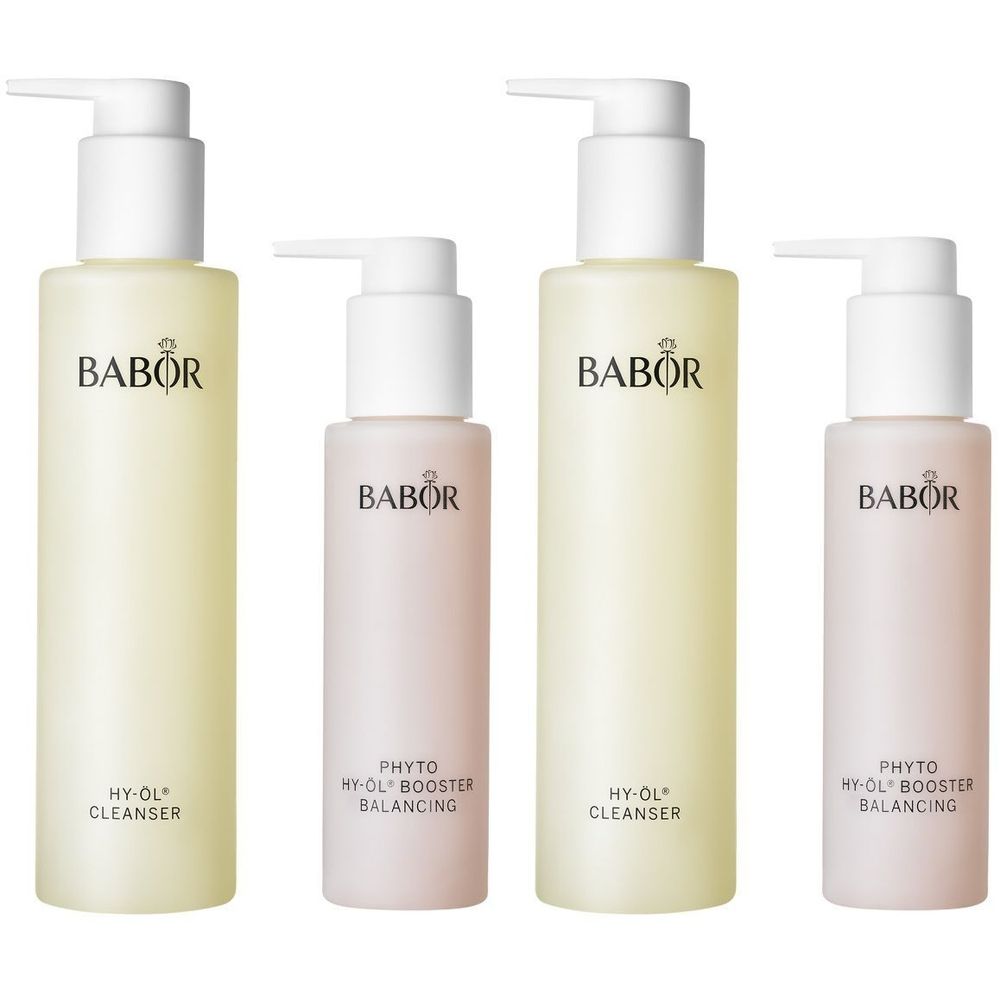 Quatre flacons. Deux grands flacons jaunâtres avec pompe et deux petits flacons roses. Inscription BABOR.