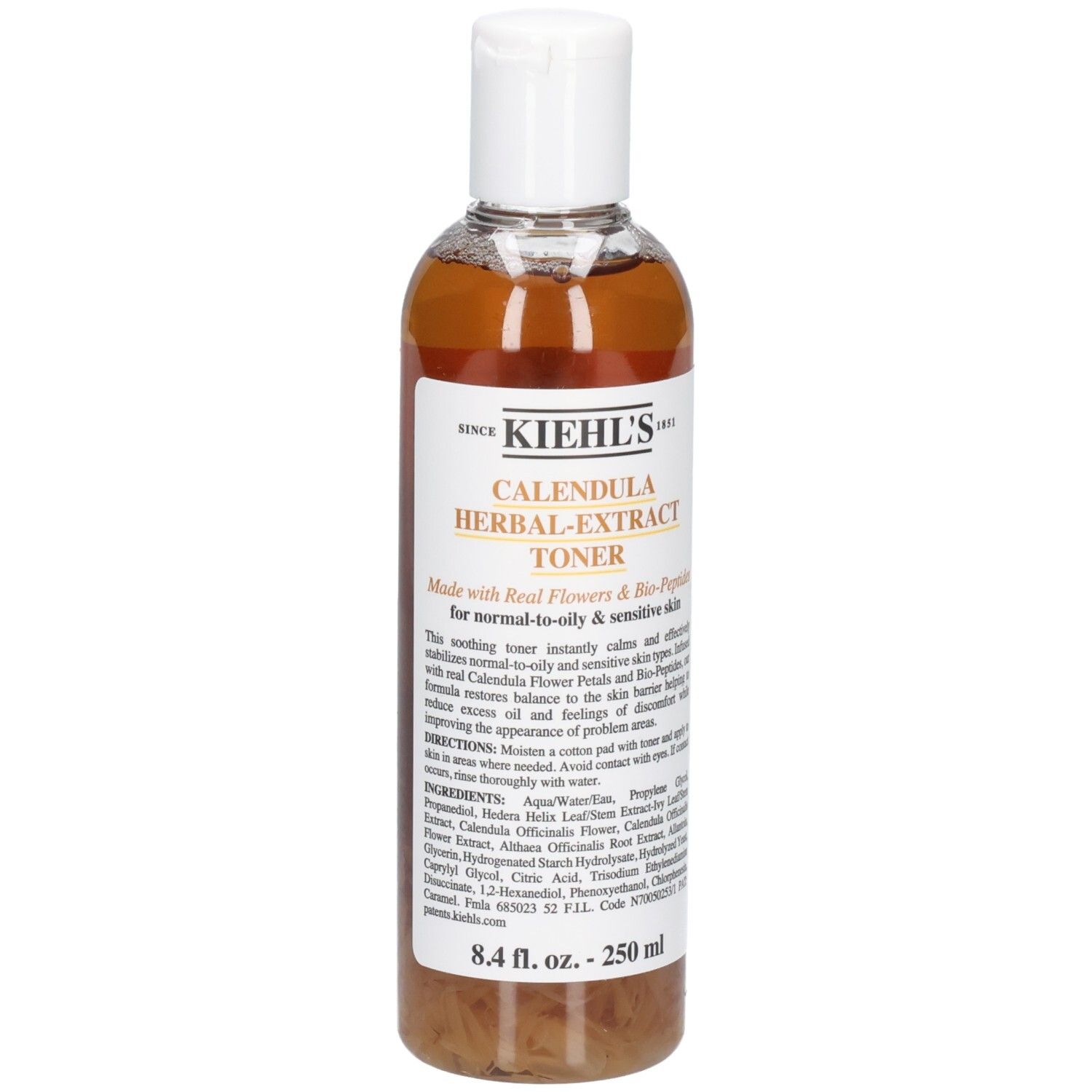Kiehl's Calendula Herbal-Extract Toner dans une bouteille transparente avec un bouchon rabattable blanc. Liquide doré avec des pétales.