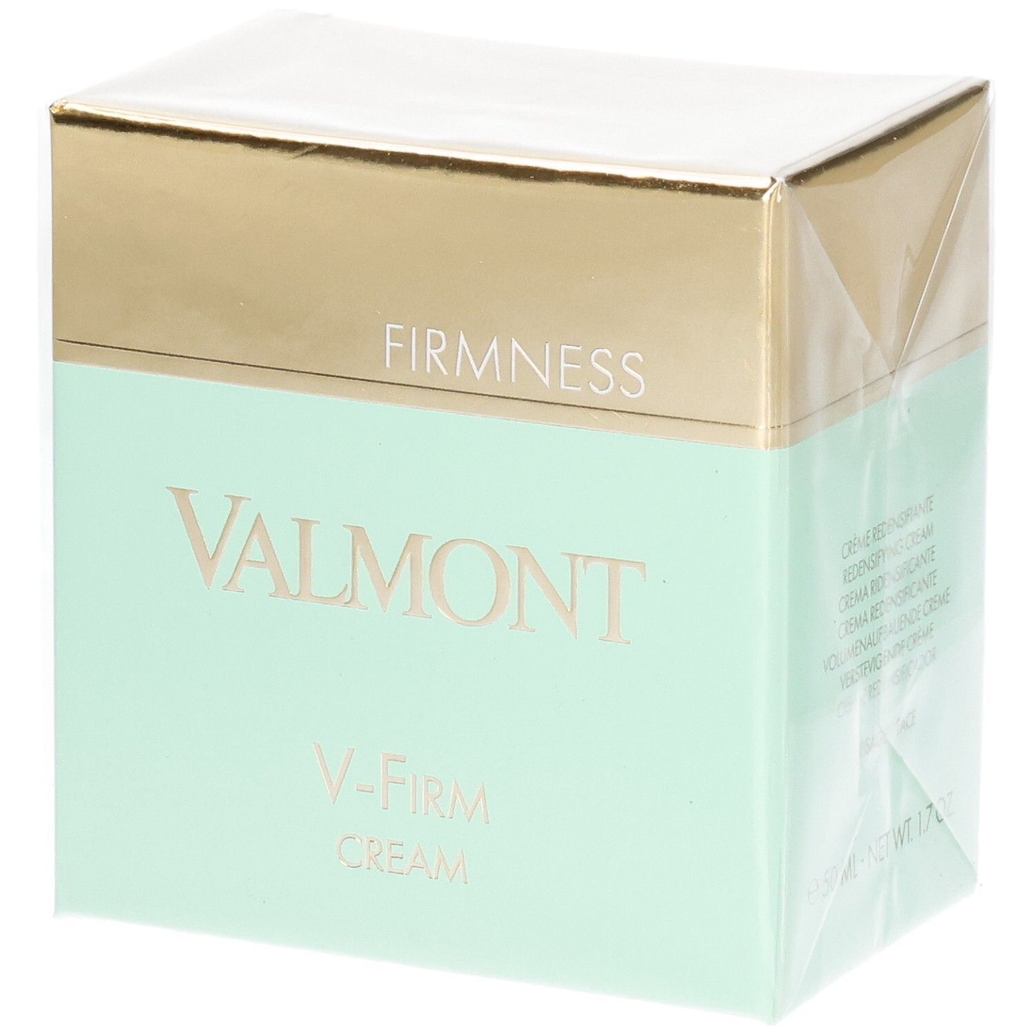 Emballage Valmont V-Firm Cream avec bandeau doré et menthe. "FIRM NESS" et "VALMONT" sont imprimés sur le devant.