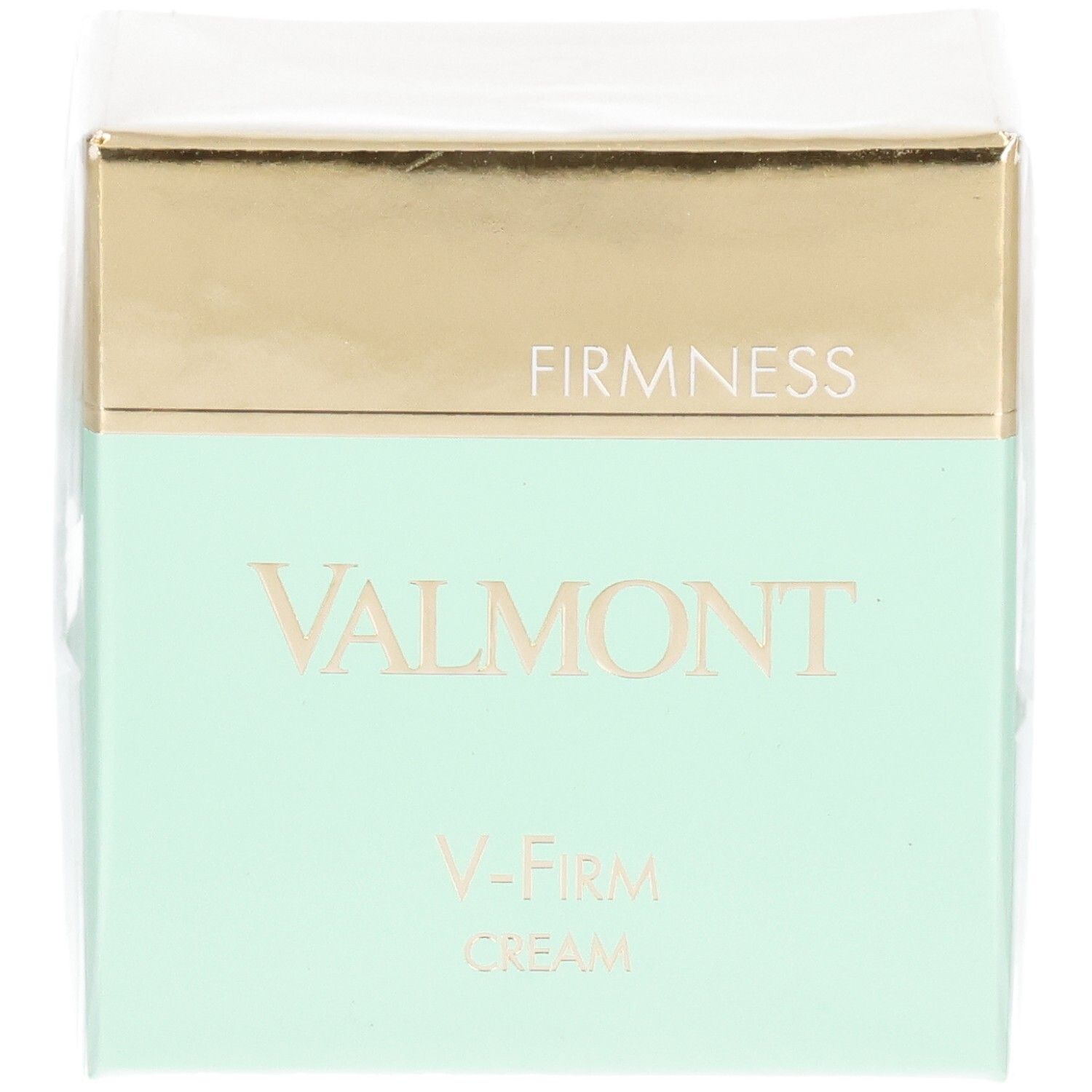 Emballage Valmont V-Firm Cream avec bandeau doré et menthe. "FIRM NESS" et "VALMONT" sont imprimés sur le devant.