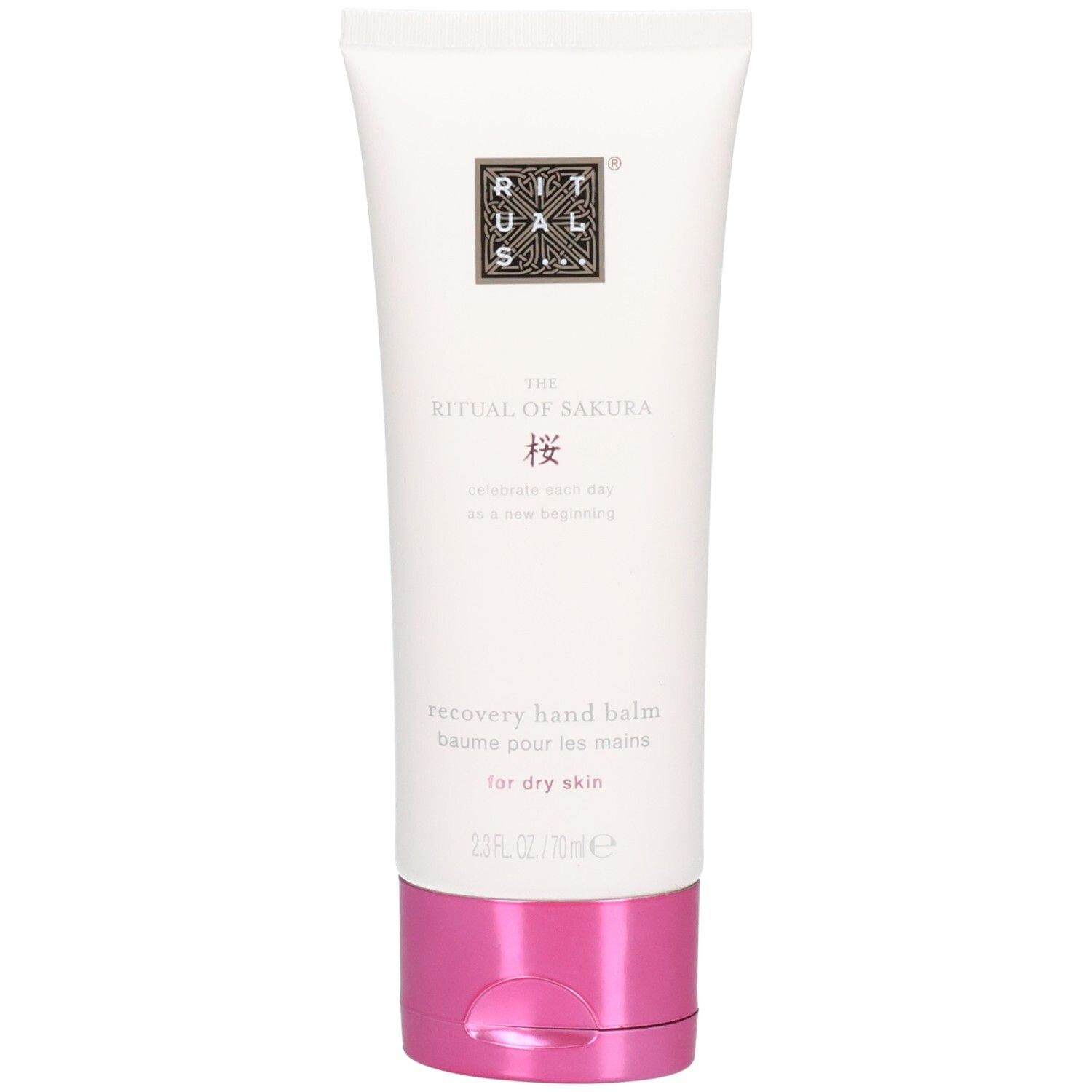 Tube blanche avec bouchon rose, inscription "The Ritual of Sakura Recovery Hand Balm".
