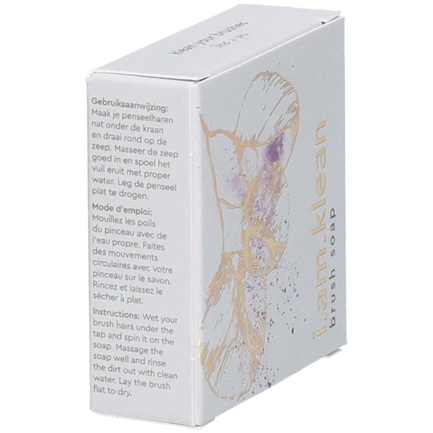 Boîte en carton en biais avec motif floral. Inscription i.am.klean Brush Soap. Instructions en plusieurs langues.