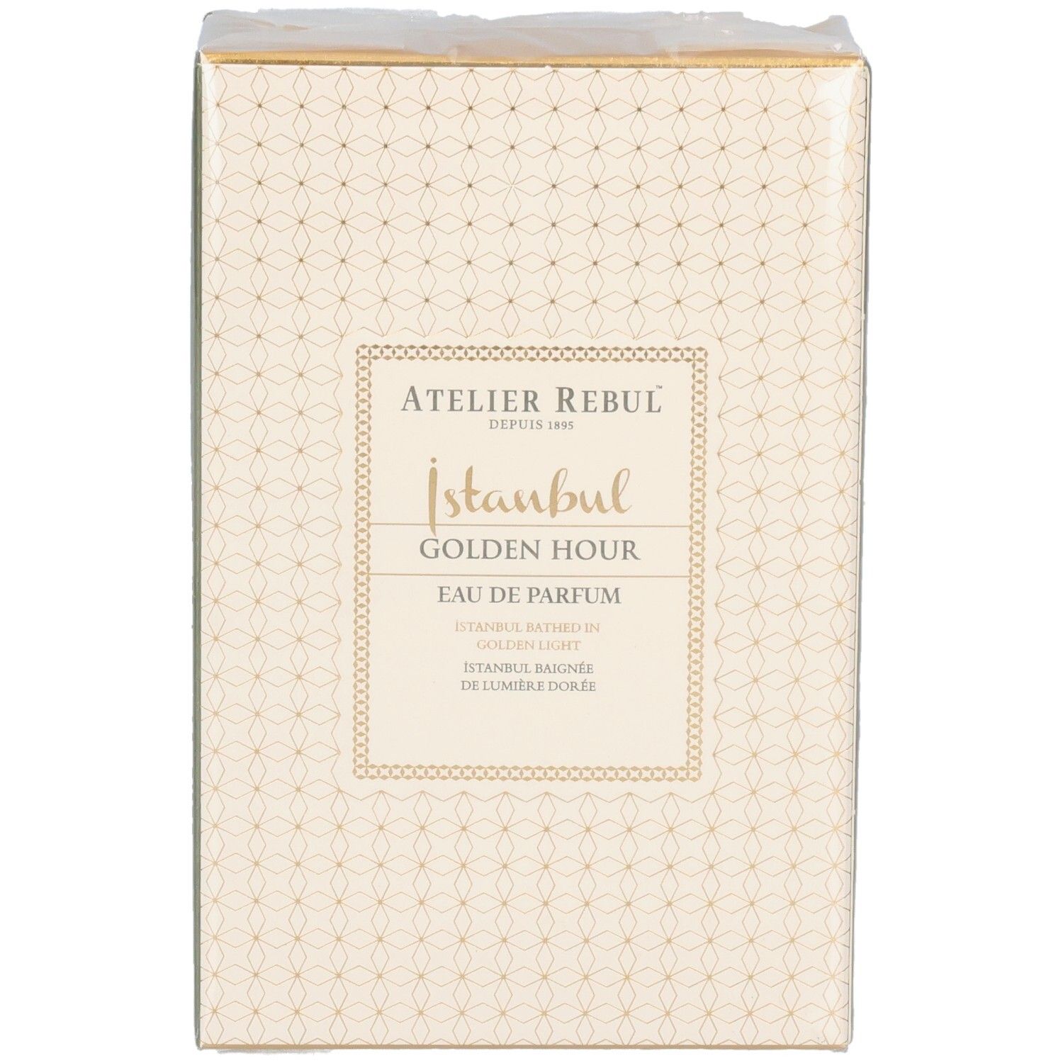 Vue de face de l'emballage Atelier Rebul Istanbul Golden Hour Eau de Parfum. Boîte beige à motifs dorés.