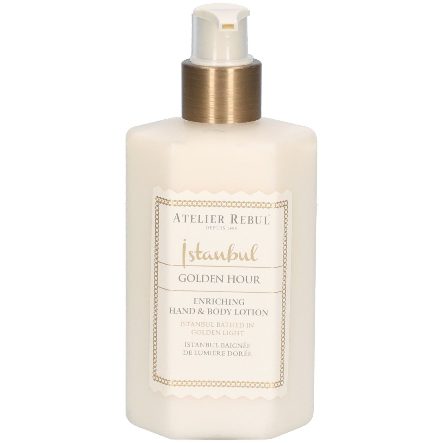 Flacon de lotion beige avec pompe dorée. Étiquette avec texte: Atelier Rebul, Istanbul, Golden Hour, lotion mains et corps.