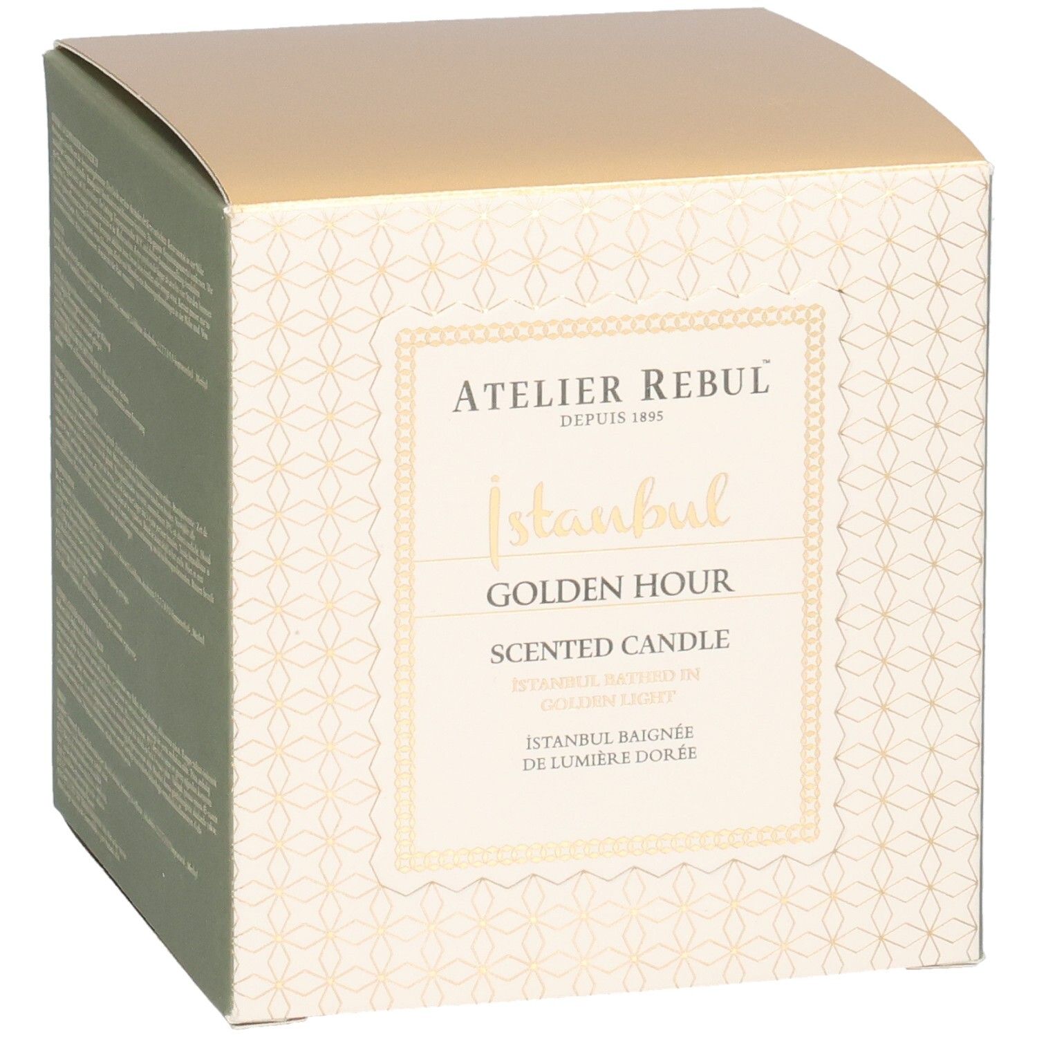 Boîte carrée. Inscription: Atelier Rebul, Istanbul Golden Hour Scented Candle. Couvercle doré, côtés crème avec motif.