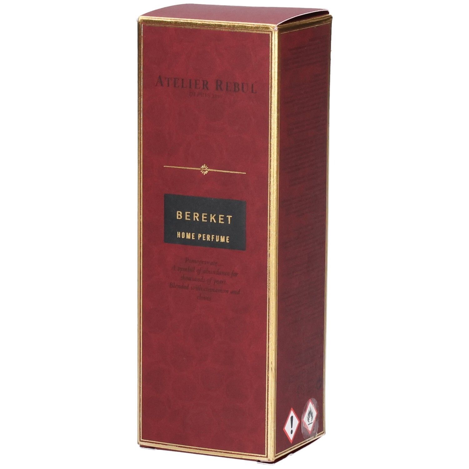 Boîte rouge avec bordure dorée, inscription "Atelier Rebul Bereket Home Perfume".