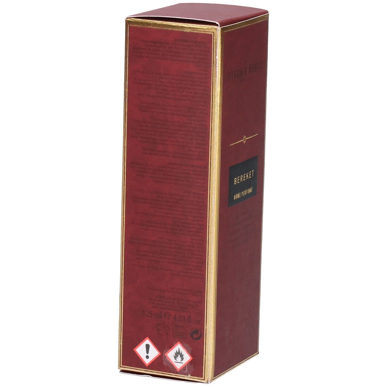 Boîte rouge avec bordure dorée, inscription "Atelier Rebul Bereket Home Perfume".