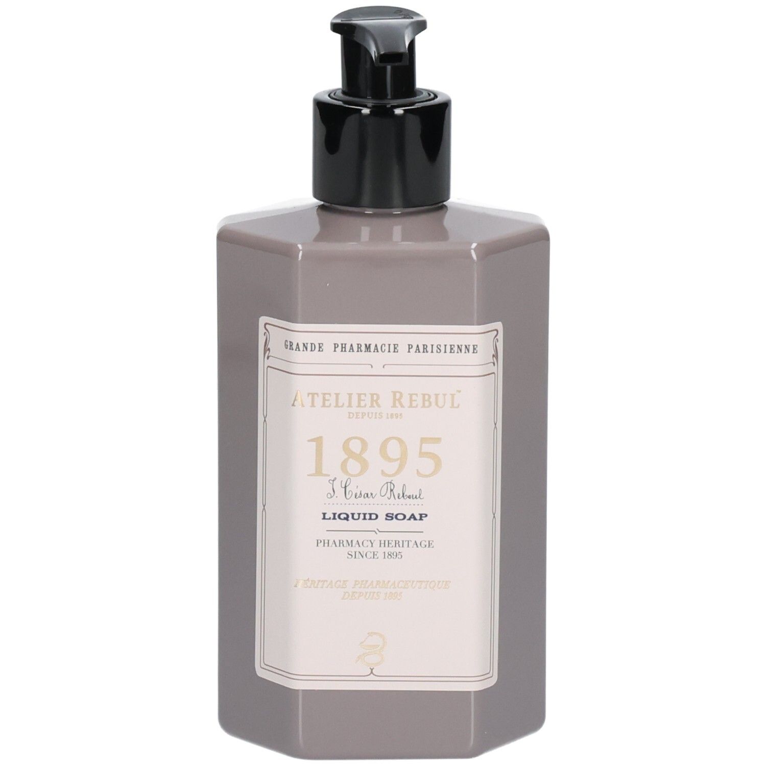Flacon de savon gris avec pompe noire et étiquette "Atelier Rebul Liquid Soap".
