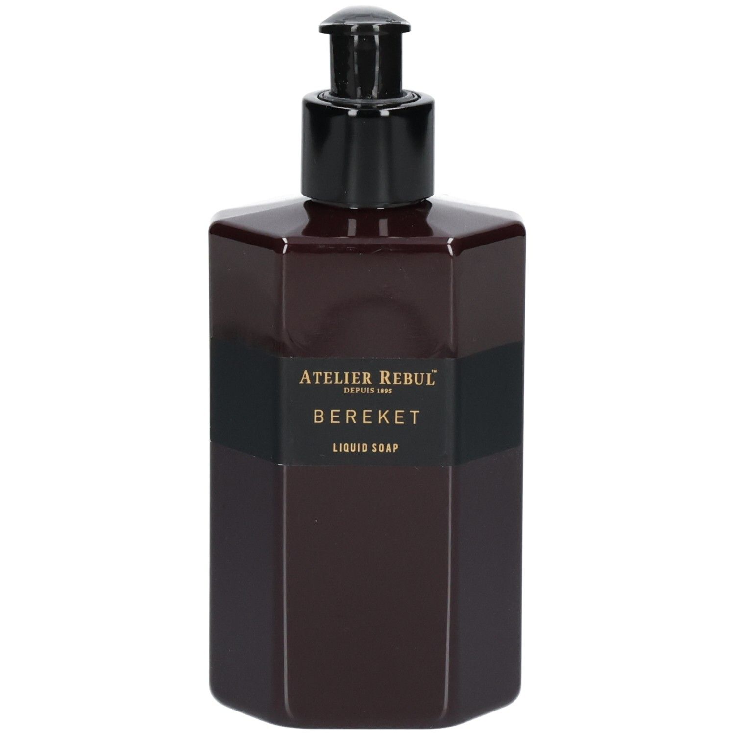 Bouteille octogonale brun foncé avec distributeur à pompe noir. Étiquette noire avec inscription dorée : Atelier Rebul, BEREKET, LIQUID SOAP.