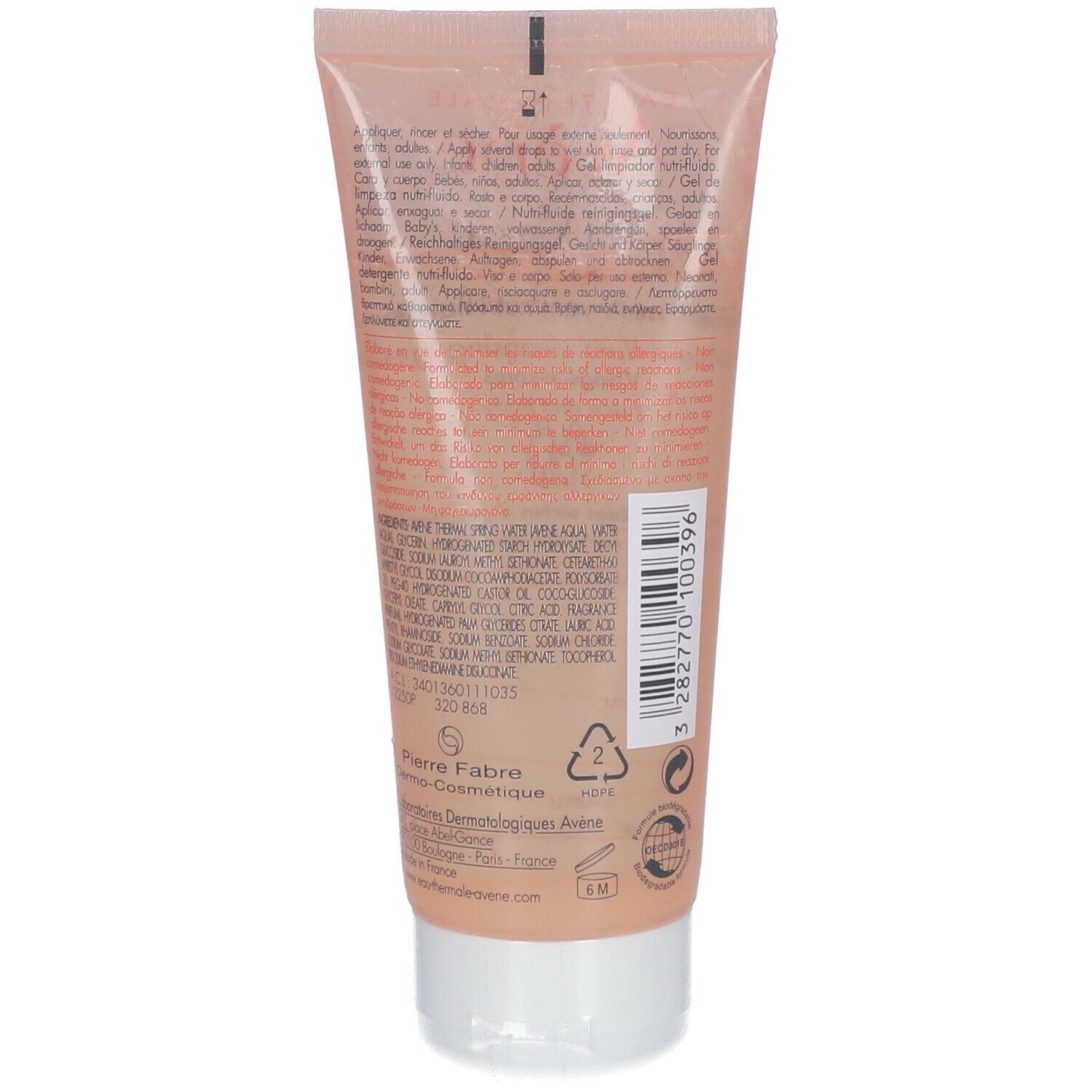 Tube de crème rose beige. Ingrédients et fabricant imprimés. Bouchon à vis blanc. Symbole de recyclage.