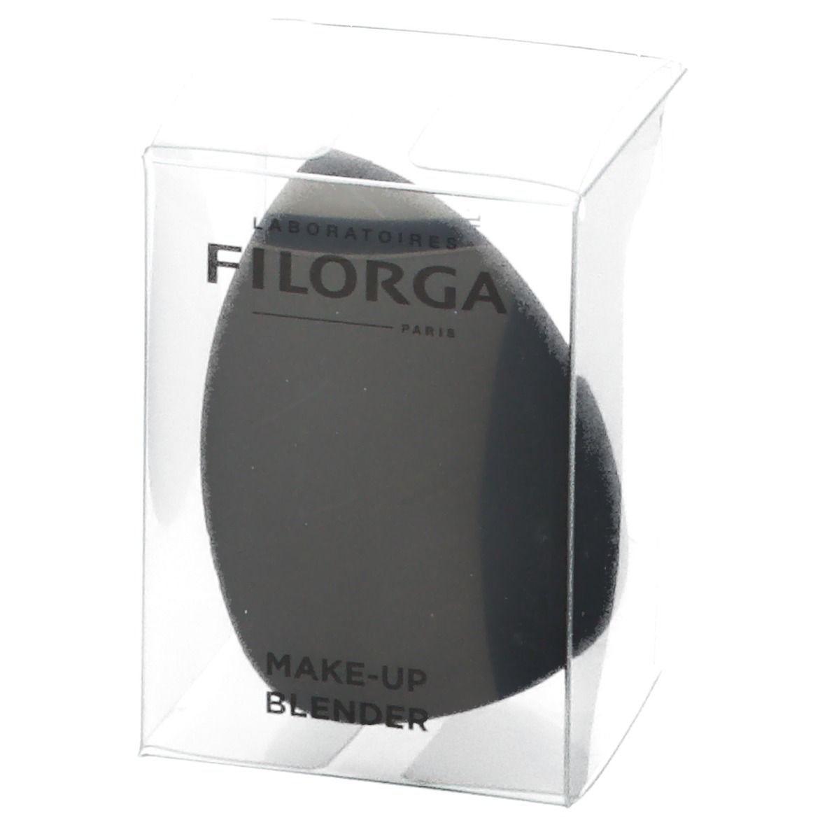 Éponge de maquillage noire dans un emballage transparent. Marque FILORGA. Inscription : MAKE-UP BLENDER.