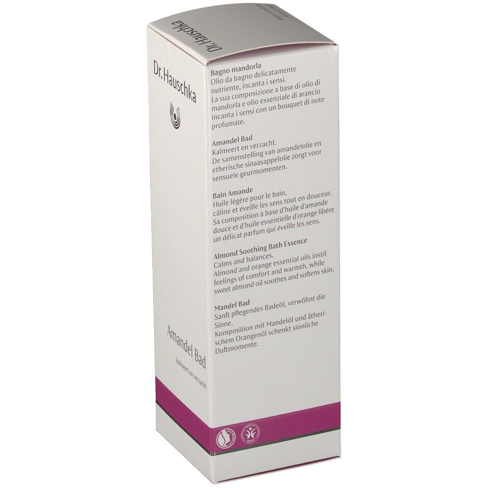 Emballage blanc avec nom du produit "Amandel Bad" et logo. Texte en plusieurs langues. Accent violet.