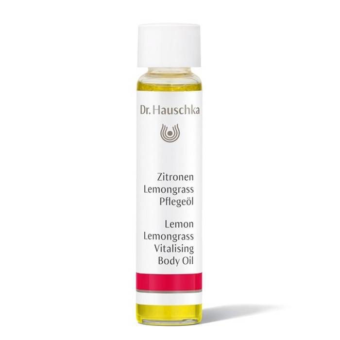 Flacon d'huile pour le corps avec bouchon blanc. Inscription : Dr. Hauschka, Citron, Lemongrass, Pflegeöl, Lemon, Lemongrass, Vitalising Body Oil.