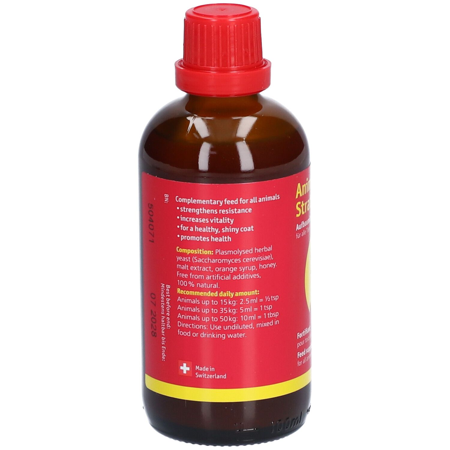 Flacon en verre brun avec bouchon rouge. Étiquette rouge avec texte. Contient des informations sur la composition et le dosage.