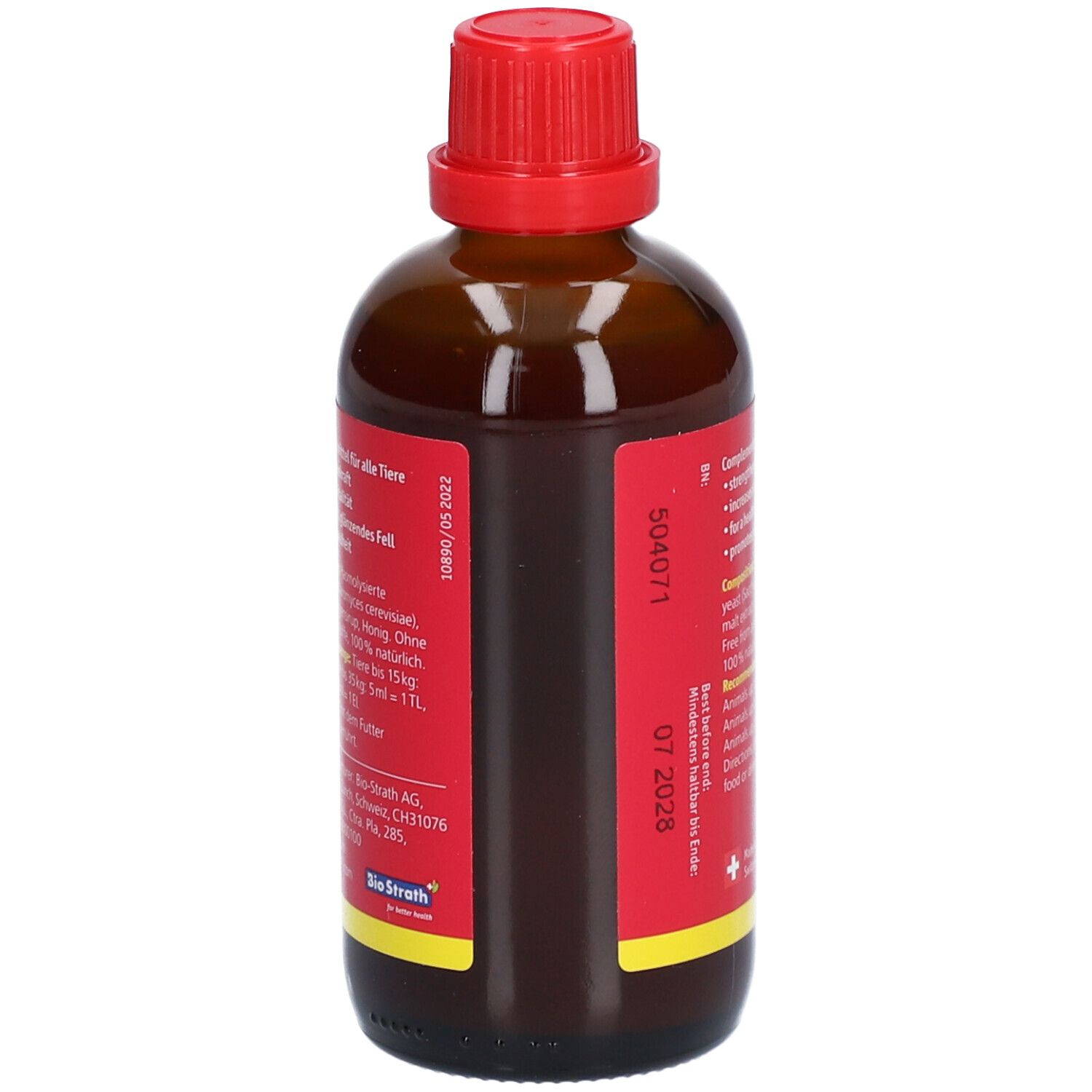 Flacon en verre brun avec bouchon rouge. Étiquette rouge avec texte. Contient des informations sur la composition et le dosage.