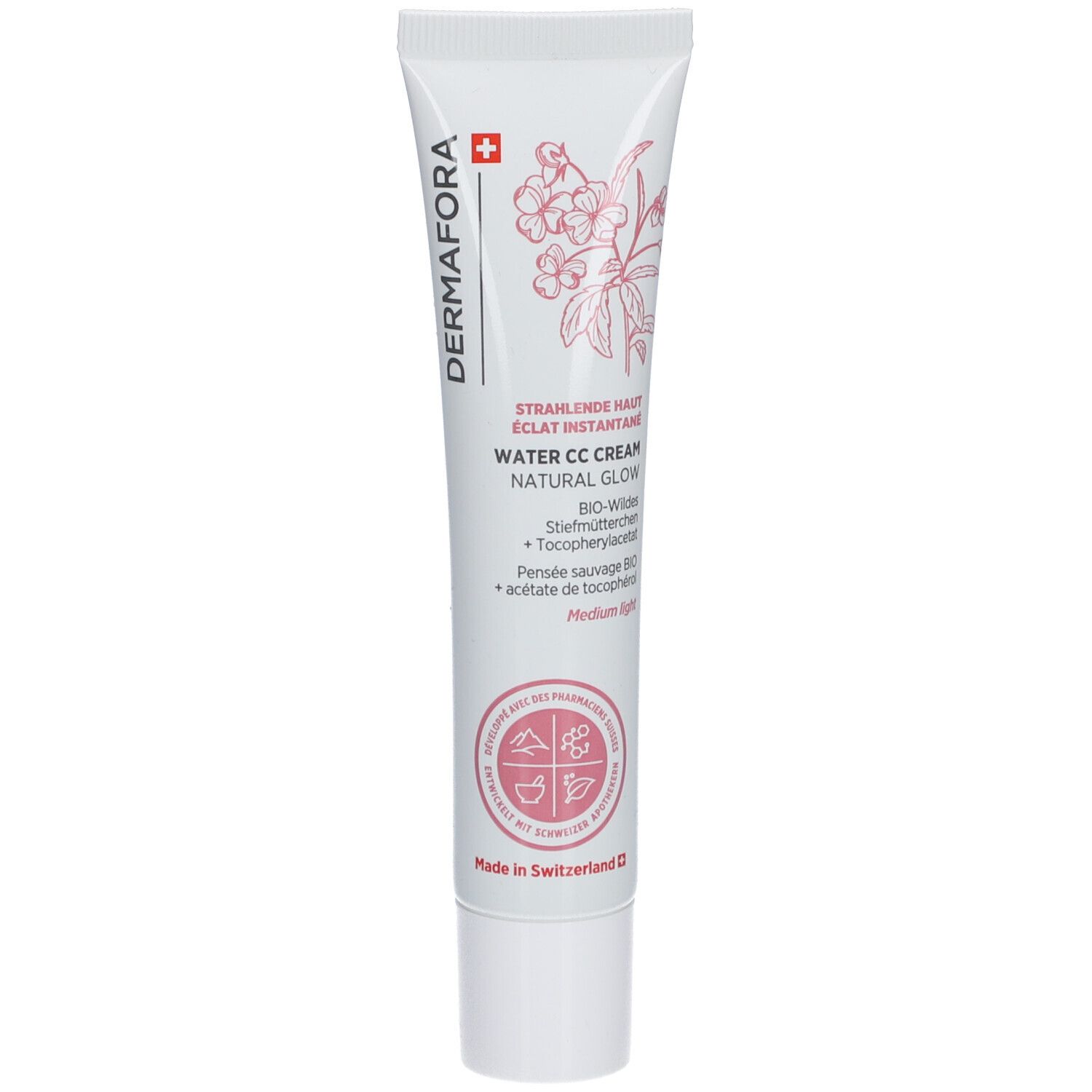 Tube blanc et rose. Inscription: Dermafora, Water CC Cream Natural Glow. Croix suisse et motif floral.