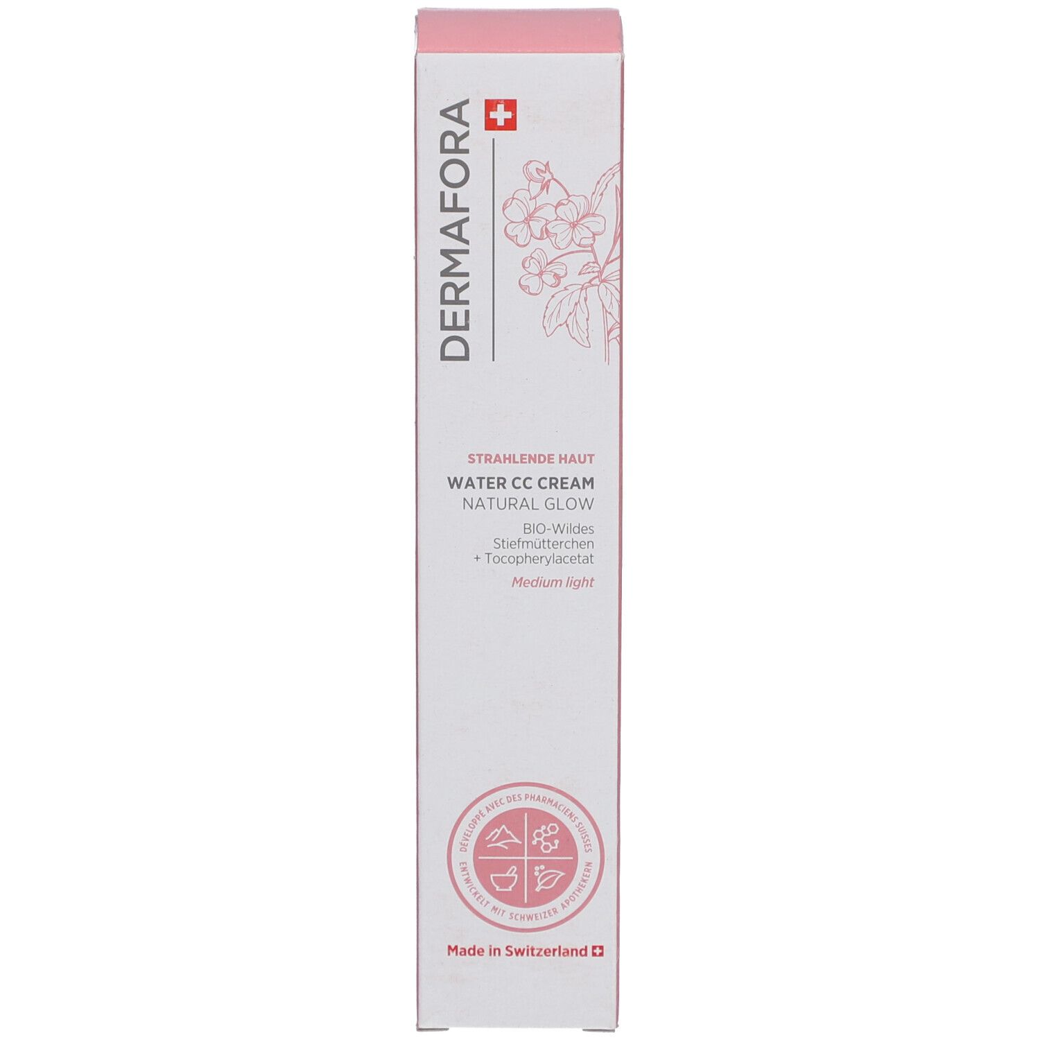 Boîte avec des accents roses. Inscription: Dermafora, Water CC Cream Natural Glow. Croix suisse et motif floral.