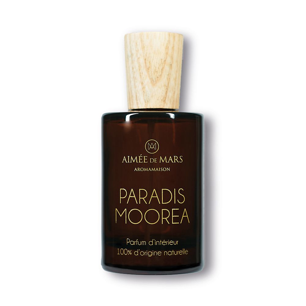 Flacon en verre brun avec bouchon en bois. Inscription : Aimée de Mars, Paradis Moorea, Parfum d'intérieur, 100% d'origine naturelle.