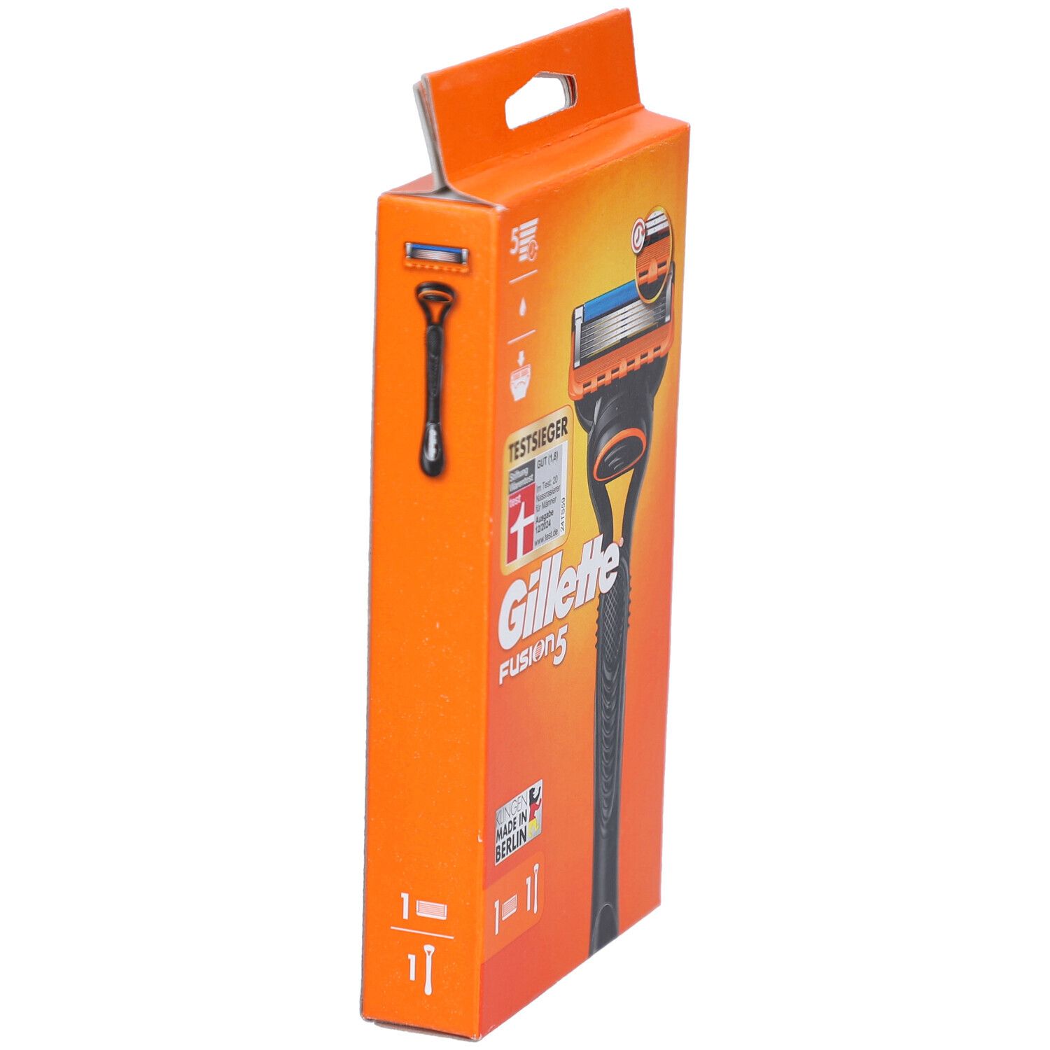 Emballage orange avec silhouette de rasoir. Texte: Gillette Fusion5, TestSieger. Image du rasoir.