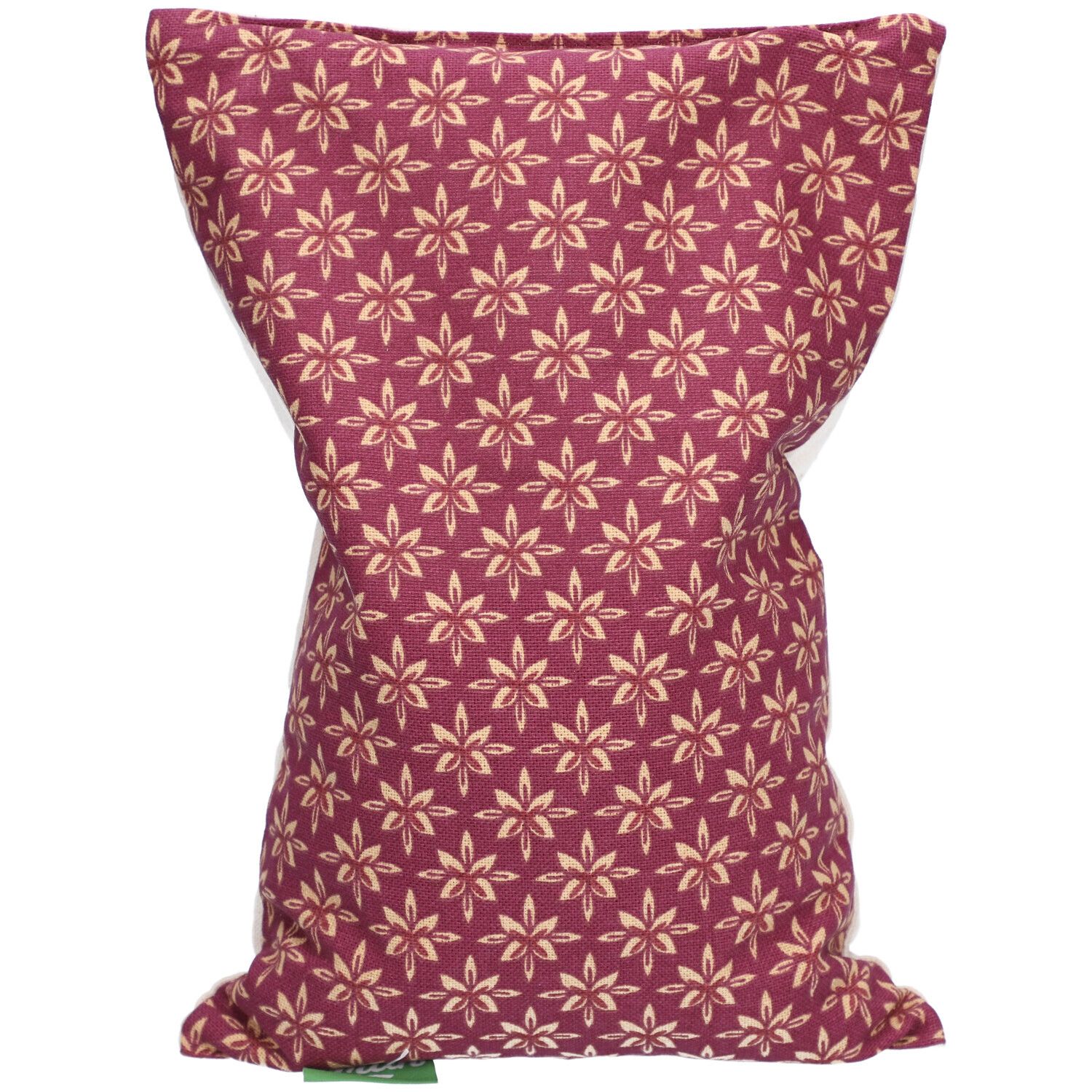 Coussin aux noyaux de cerises à motif floral. Tissu bordeaux avec fleurs beiges. Forme rectangulaire.