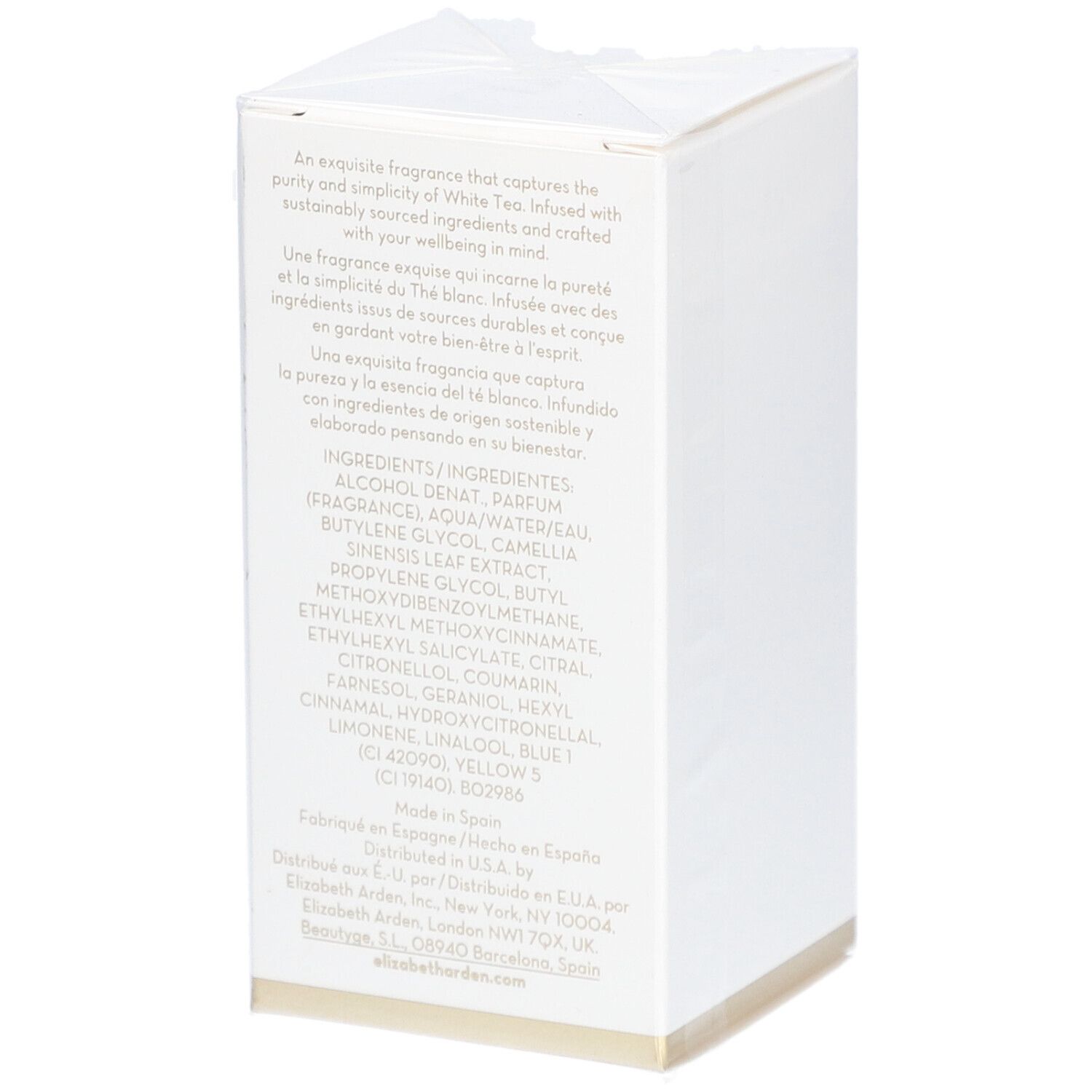 Boîte rectangulaire blanche avec texte. Contient les ingrédients et les informations du fabricant. Bord doré en bas.