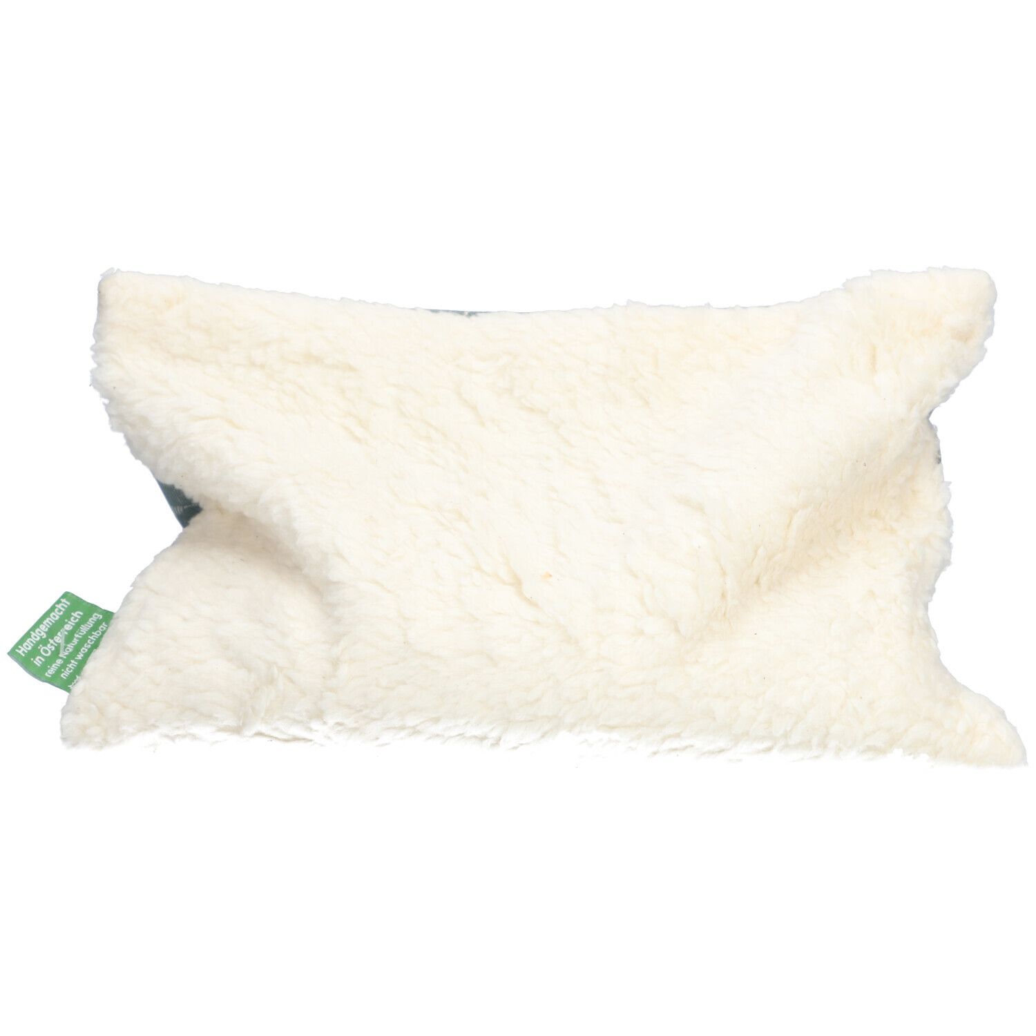 Coussin chauffant aux noyaux de cerises, matériau blanc et moelleux. Étiquette verte avec texte.