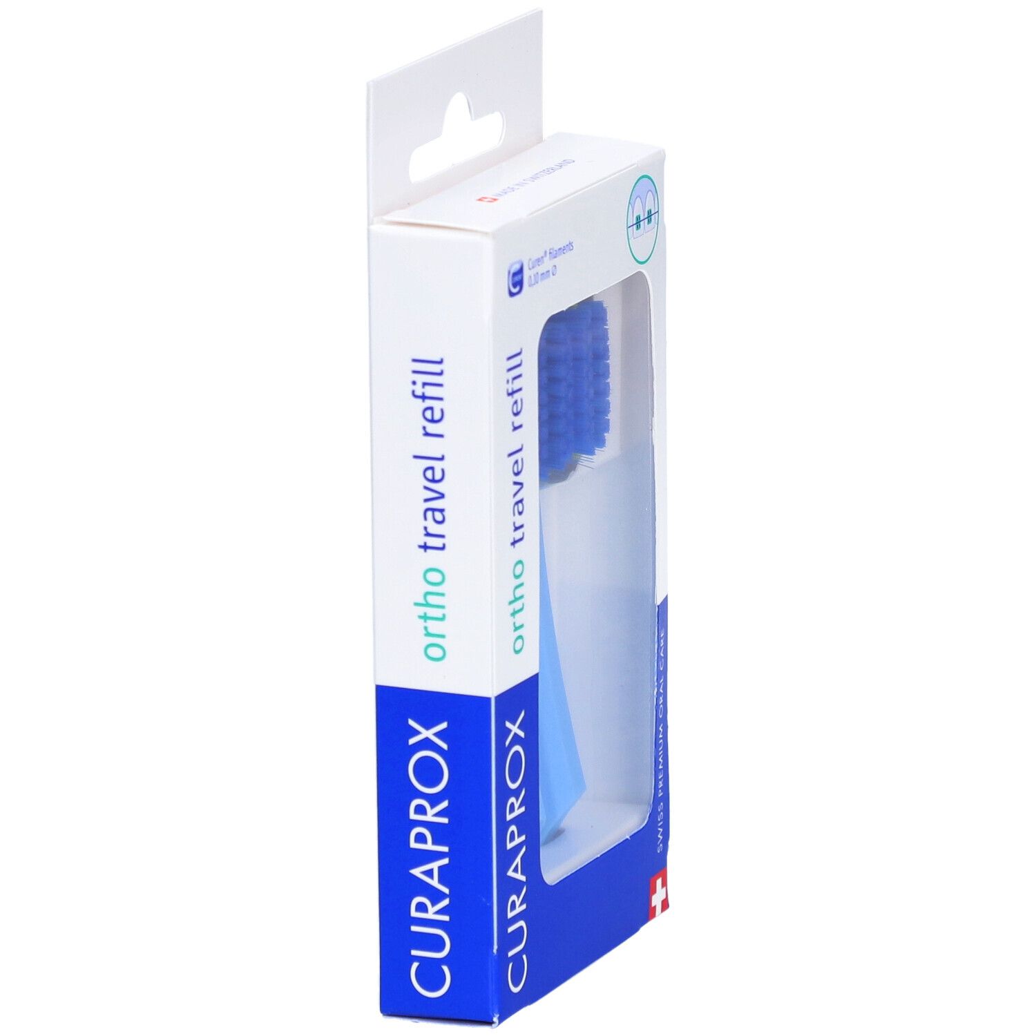 Emballage avec une tête de brosse à dents bleue. Inscription : CURAPROX, ortho travel refill. Fenêtre transparente.