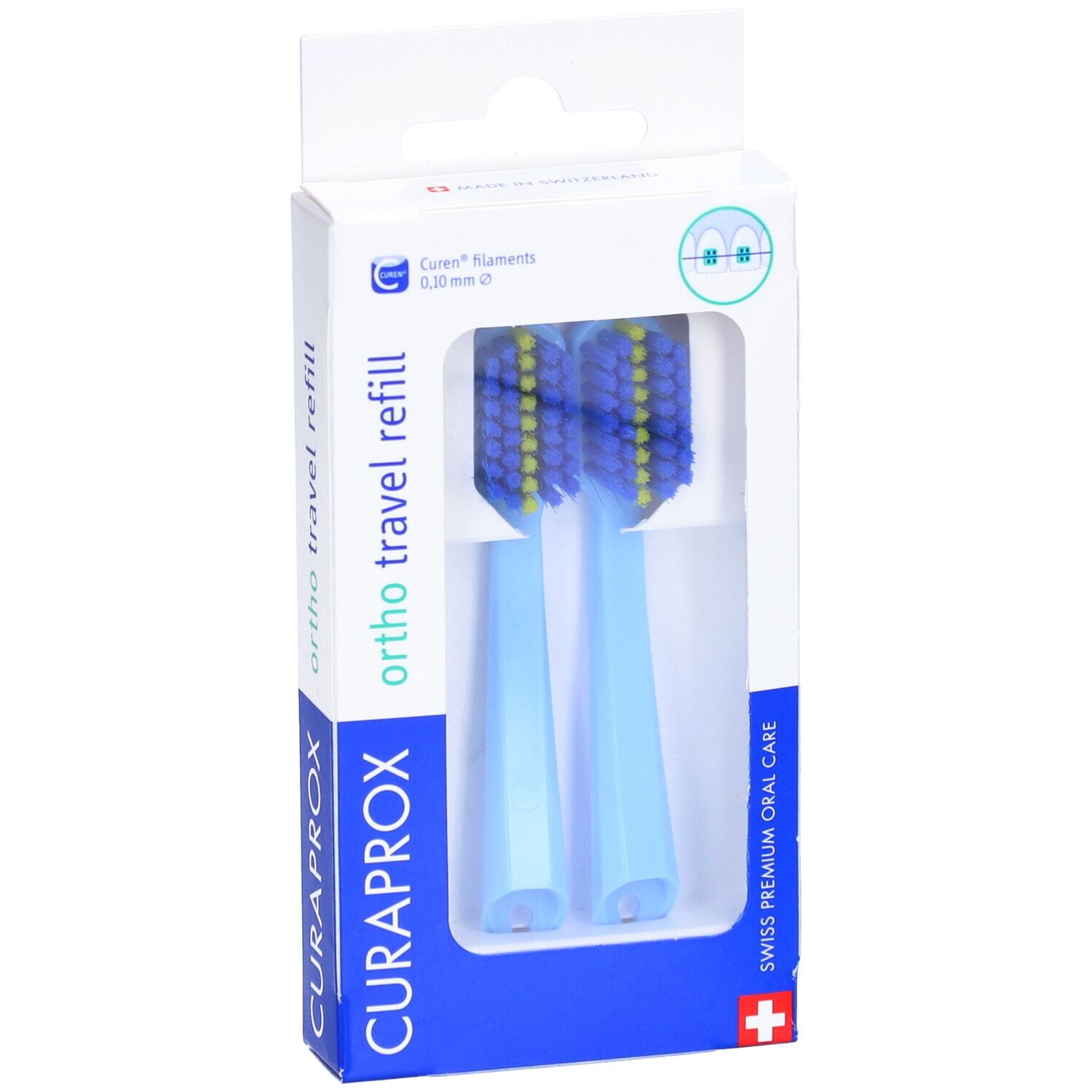 Deux têtes de brosse à dents bleues avec des poils jaunes dans un emballage blanc. Inscription : CURAPROX, ortho travel refill.